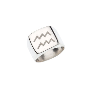 Square silver signet ring with engraved Aquarius symbol.