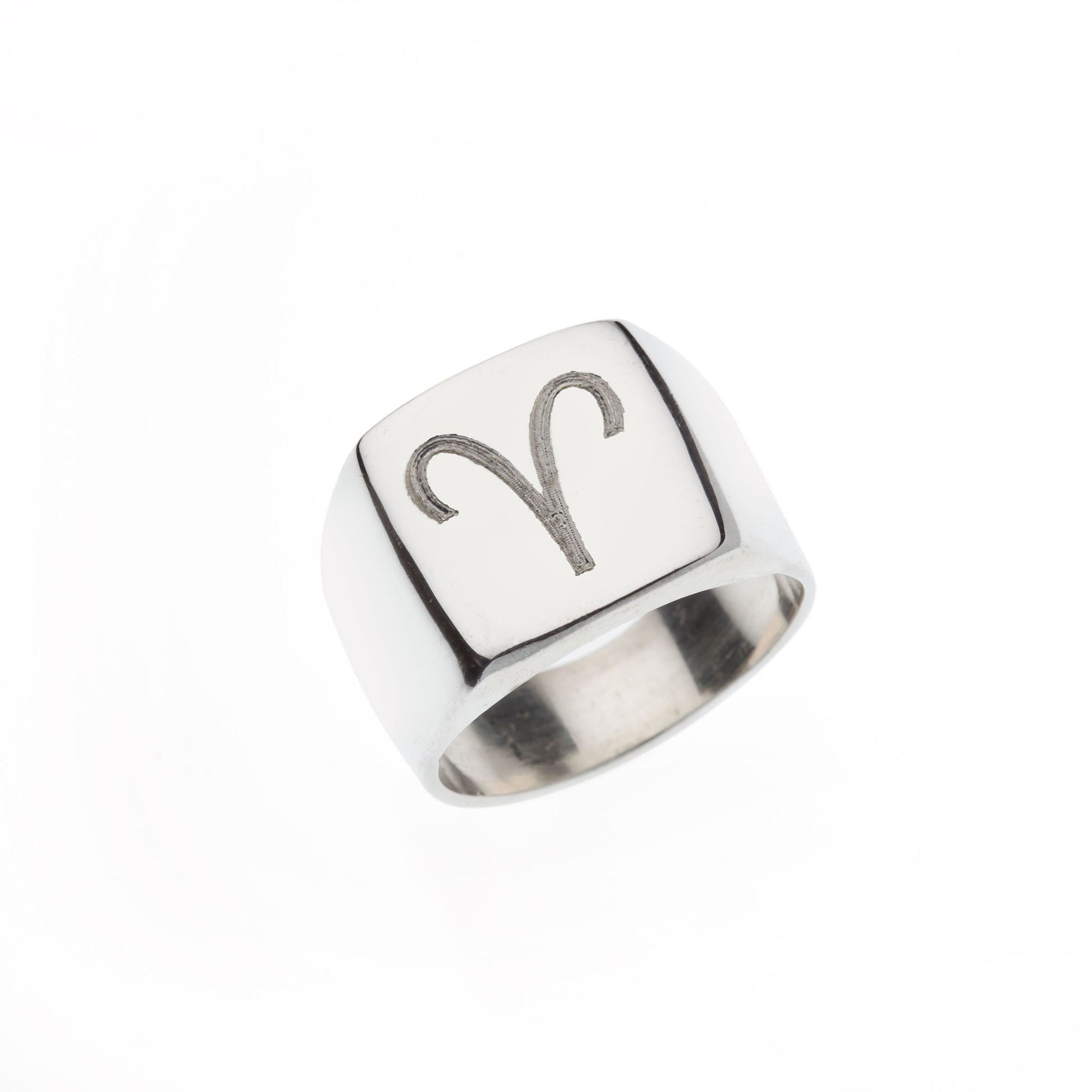 Square silver signet ring with engraved Aries symbol.