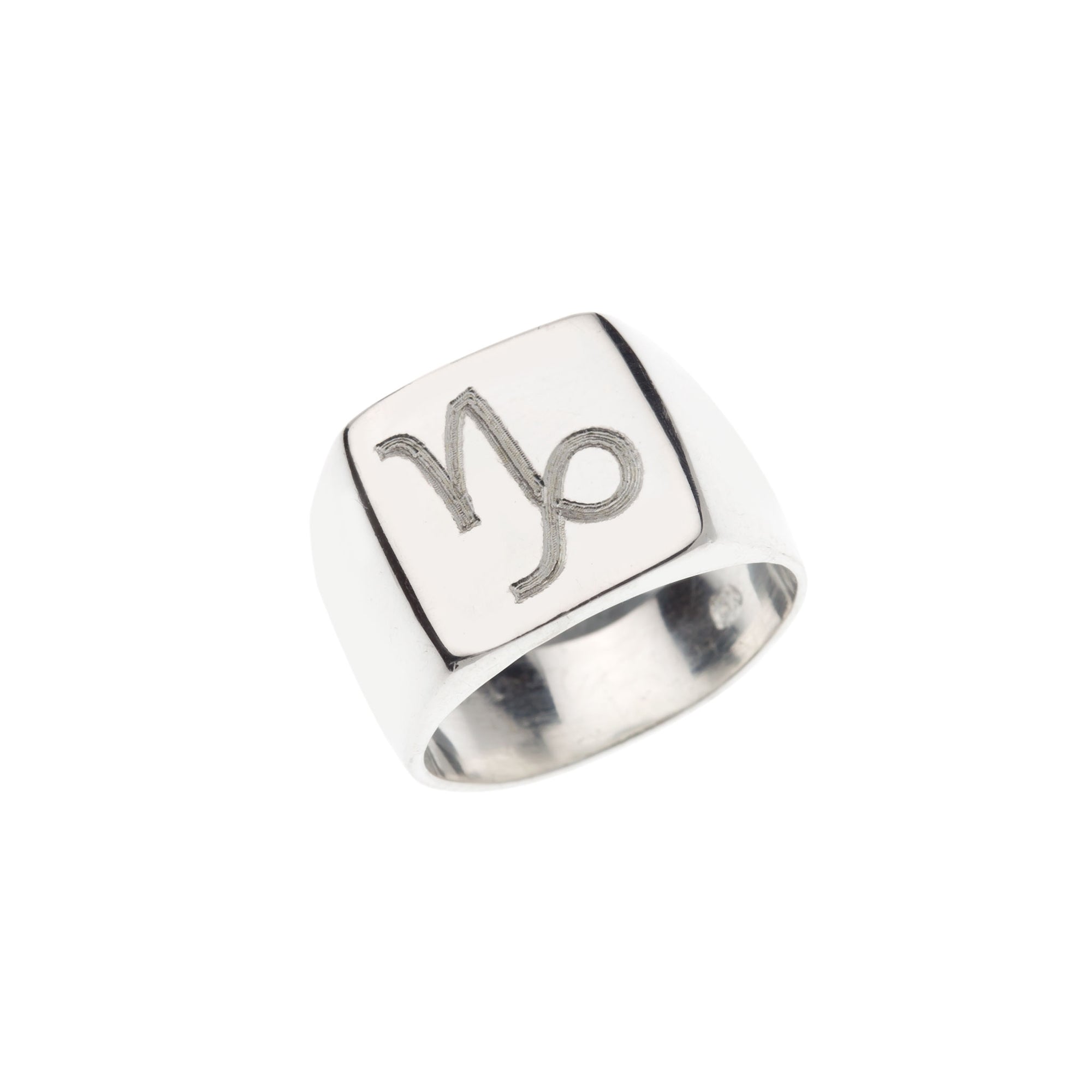 Square silver signet ring with engraved Capricorn symbol.