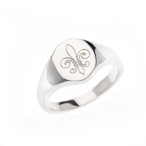 Oval silver signet ring with engraved Fleur de Lis symbol.