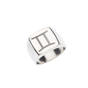 Square silver signet ring with engraved Gemini symbol.