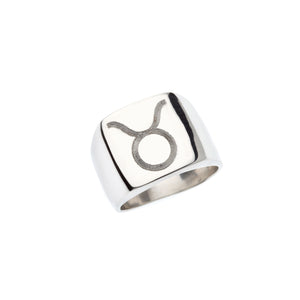 Square silver signet ring with engraved Taurus symbol.